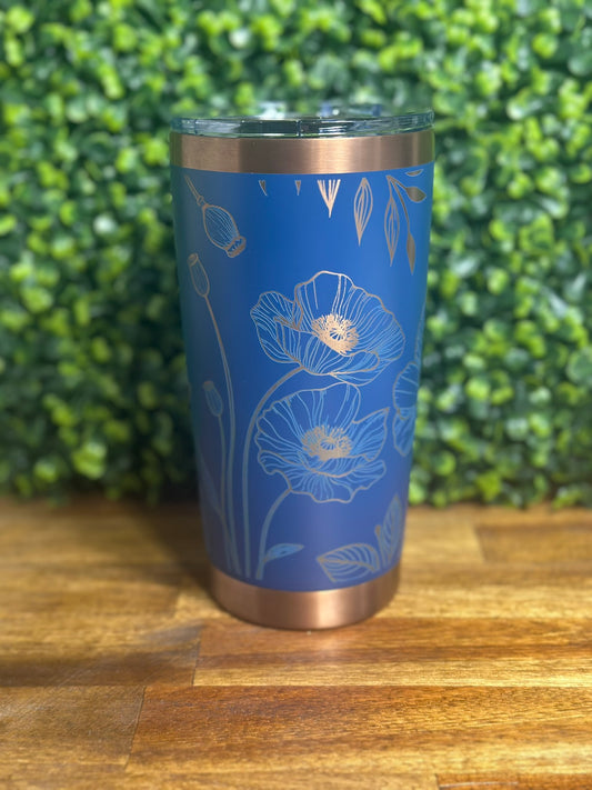 Custom designed blue and copper Poppy tumbler featuring floral patterns, perfect for morning coffee.